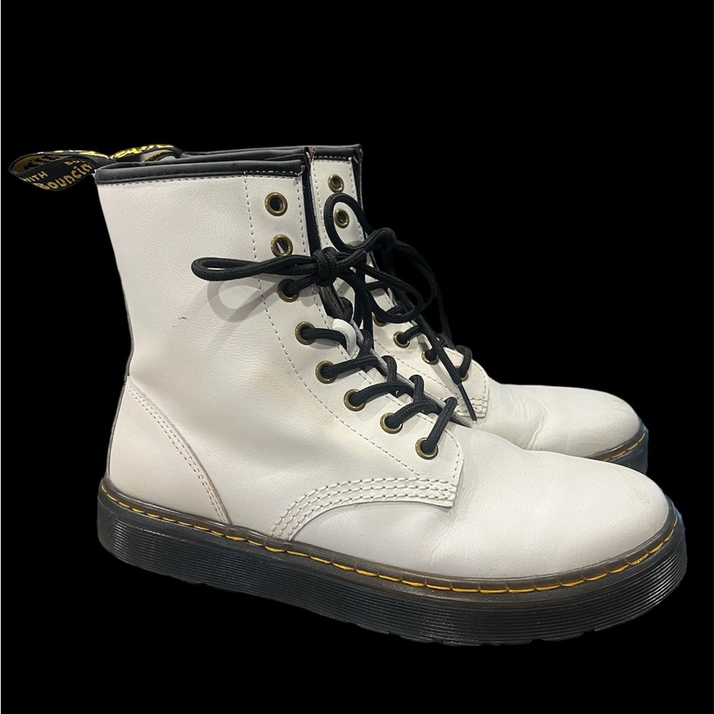 White women’s Dr. Marten’s high boot